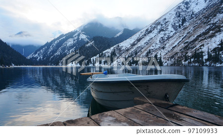 Mountain lake in the forest with mirror water Mountain lake in the forest with mirror water 97109933