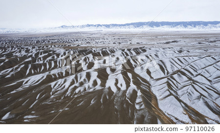 The high hills are like waves covered with snow 97110026