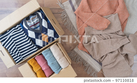 Clothes in cardboard | Changing, discarding, and recycling image Clothes in cardboard | Changing, discarding, and recycling image 97110818