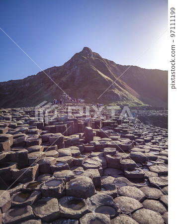 A few of the 40000 interlocking basalt columns at the Giant's Causeway by Bushmills in Northern Ireland, United Kingdom A few of the 40000 interlocking basalt columns at the Giant's Causeway by Bushmills in Northern Ireland, United Kingdom 97111199