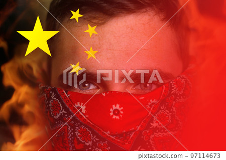 Protests China. Chinese real estate and debt crisis. Zero covid and lockdown protest in China. Young man in bandana. Revolution demonstration. Fire, flame Protests China. Chinese real estate and debt crisis. Zero covid and lockdown protest in China. Young man in bandana. Revolution demonstration. Fire, flame 97114673