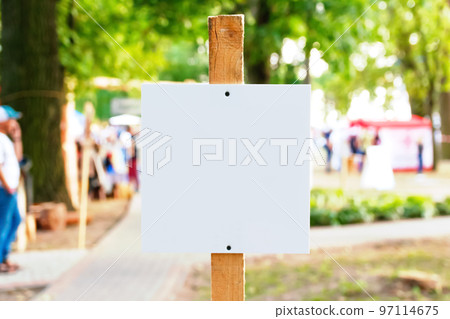 Defocus empty template, advertising mock-up, banner on grass near green park festival.Copy space for text. Information board on green background. Out of focus Defocus empty template, advertising mock-up, banner on grass near green park festival.Copy space for text. Information board on green background. Out of focus 97114675