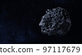 Asteroid or a meteorite flies in space. 97117679