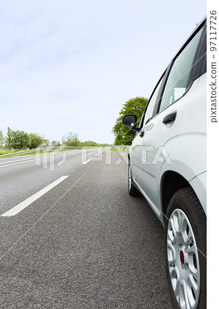 Rear ride view of a generic light color car 97117726