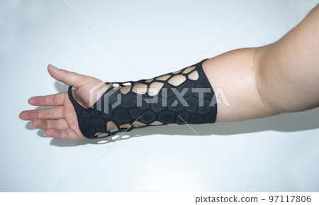 Orthopedic plastic prosthesis printed on powder 3D printer on hand. Gypsum close-up. Multi Jet Fusion MJF 3D printing technology. Modern progressive additive technology Orthopedic plastic prosthesis printed on powder 3D printer on hand. Gypsum close-up. Multi Jet Fusion MJF 3D printing technology. Modern progressive additive technology 97117806