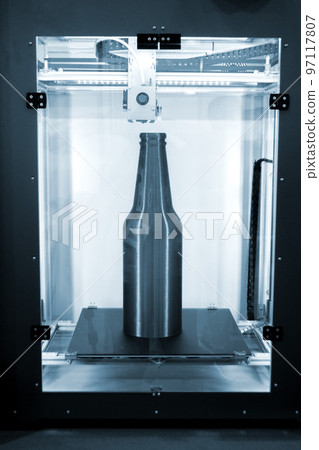 Object green bottle printed on 3D printer close-up, inside on desktop of 3d printer. Progressive modern additive technology. Concept 4.0 industrial revolution. Modern 3D printing additive technology Object green bottle printed on 3D printer close-up, inside on desktop of 3d printer. Progressive modern additive technology. Concept 4.0 industrial revolution. Modern 3D printing additive technology 97117807