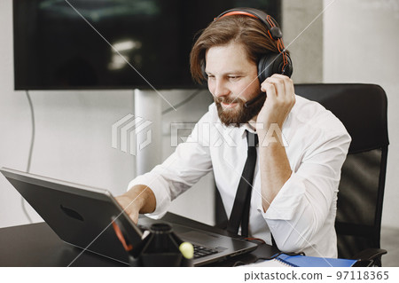 Handsome man in a white shirt. Businessman working online. 97118365