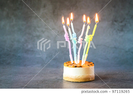 Birthday cake cupcake with colorful burning candles 97119265