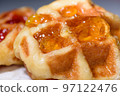 Close up fresh waffles topped with above pineapple jam 97122476