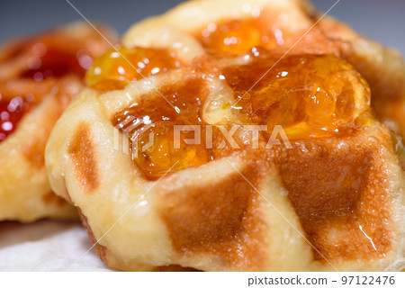 Close up fresh waffles topped with above pineapple jam Close up fresh waffles topped with above pineapple jam 97122476