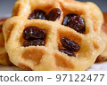 Close up fresh waffles with above dried raisins 97122477