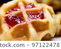 Close up fresh waffles with above strawberry jam 97122478