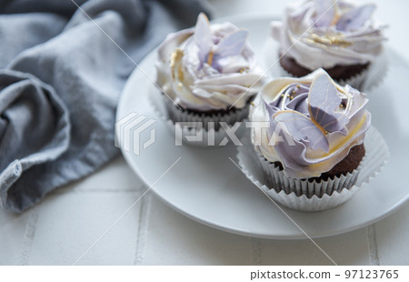 Cupcakes with butterfly decorations Cupcakes with butterfly decorations 97123765