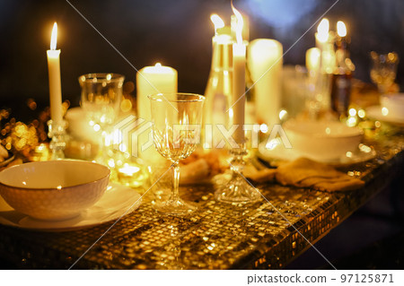 Incredible romantic dinner with cadles in winter cave 14 february. Baikal lake, winter time 97125871