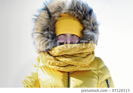 Portrait of blond real pretty woman in fur coat and yellow hat at winter background. Baikal lake Portrait of blond real pretty woman in fur coat and yellow hat at winter background. Baikal lake 97126515