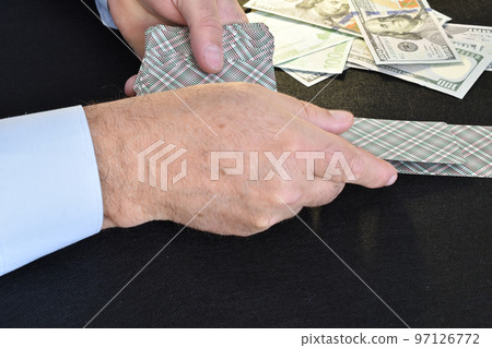 Poker game. The cards are dealt face down by the player. 97126772