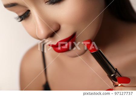 Beautiful woman with red lipstick on light background, closeup 97127737