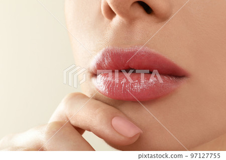 Woman with beautiful full lips on beige background, closeup 97127755