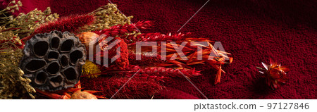 Trendy color viva magenta dry flowers on textile background. 97127846