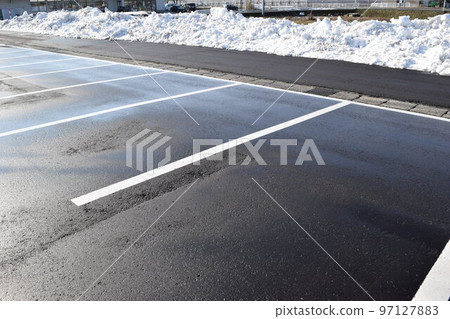 Snow-removed parking lot in a heavy snowfall area 97127883