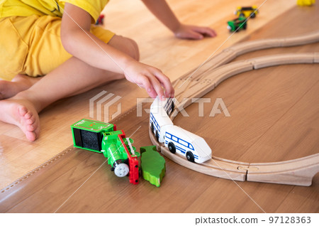 Children and kids playing with train toys Children and kids playing with train toys 97128363