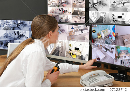 Security guard with portable transmitter at workplace 97128742