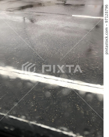 Scenery looking at the window where the rain is hitting from inside the car Scenery looking at the window where the rain is hitting from inside the car 97128796