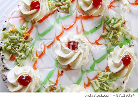 Traditional sweet birthday cake with colorful candles. Traditional sweet birthday cake with colorful candles. 97129354
