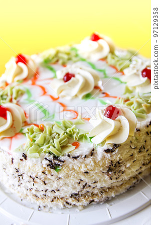 Traditional sweet birthday cake with colorful candles. Traditional sweet birthday cake with colorful candles. 97129358