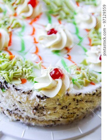 Traditional sweet birthday cake with colorful candles. Traditional sweet birthday cake with colorful candles. 97129359