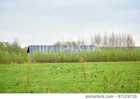 Solar panels on a green grass field Solar panels on a green grass field 97129710