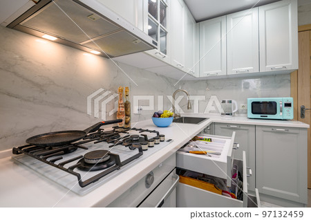 White and grey new modern well designed kitchen interior White and grey new modern well designed kitchen interior 97132459