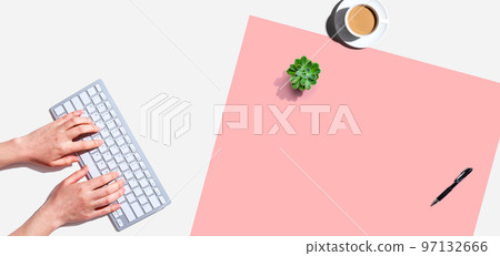 Woman using a computer keyboard Woman using a computer keyboard 97132666
