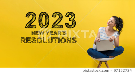 2023 New Years Resolutions with woman using a laptop 97132724