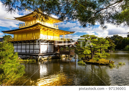 Scenic view of Kinkaku-ji shrine golden temple building view at fall 97136001