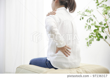 A middle-aged woman who is unwell due to shoulder pain A middle-aged woman who is unwell due to shoulder pain 97136317