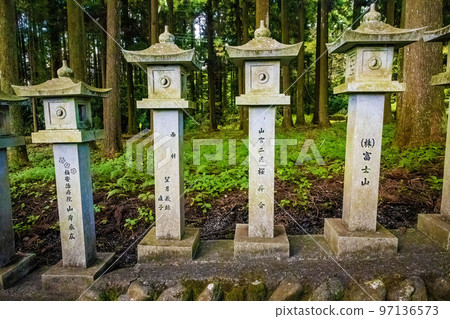Japanese stone toro lanterns at shrine entrance Japanese stone toro lanterns at shrine entrance 97136573