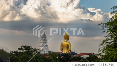 Back side view of Beautiful The Giant Golden Buddha Statue and White Pagada against the sky background. 97139750