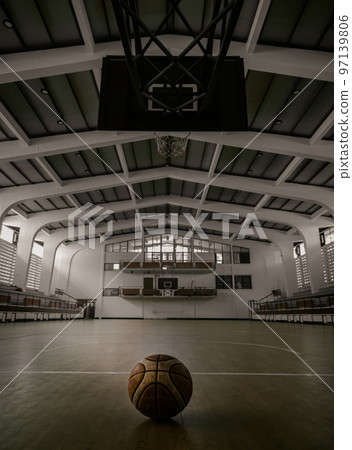 Basketball ball placed on court floor in the basketball gym. Basketball ball placed on court floor in the basketball gym. 97139806