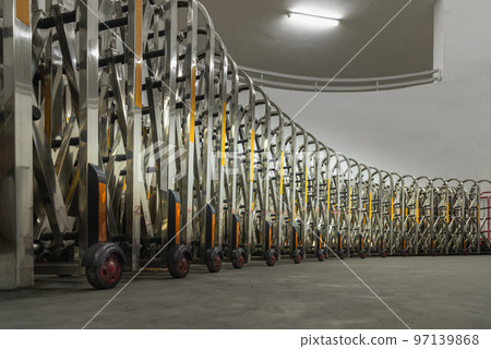 Retractable stainless steel barrier installed as a fence used to keep unauthorized people into the property. Aluminium alloy expandable fence, Expanding metal barrier, Collapsible fence, 97139868