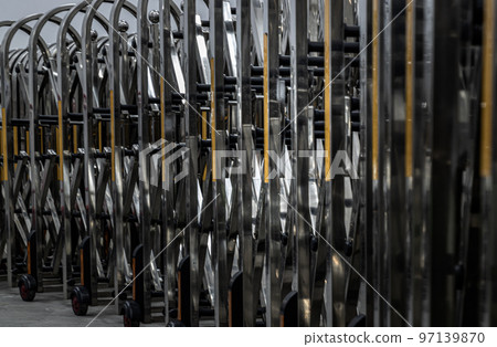 Retractable stainless steel barrier installed as a fence used to keep unauthorized people into the property. Aluminium alloy expandable fence, Expanding metal barrier, Collapsible fence, 97139870