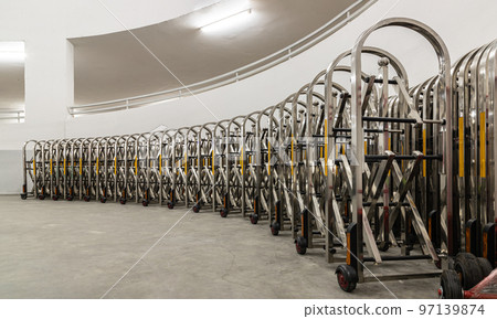 Retractable stainless steel barrier installed as a fence used to keep unauthorized people into the property. Aluminium alloy expandable fence, Expanding metal barrier, Collapsible fence, 97139874