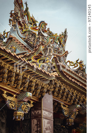 Taiwanese dragon sculpture decorate on Taiwanese temple roof at Wat thamma katanyu or Tham Katanya Shrine Foundation. Taiwanese dragon sculpture decorate on Taiwanese temple roof at Wat thamma katanyu or Tham Katanya Shrine Foundation. 97140145