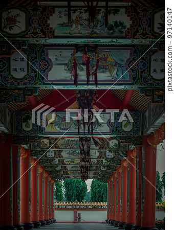 A diminishing perspective view of Pathway at Wat thamma katanyu. Scenic idyllic walkway in Taiwanese temple. A diminishing perspective view of Pathway at Wat thamma katanyu. Scenic idyllic walkway in Taiwanese temple. 97140147