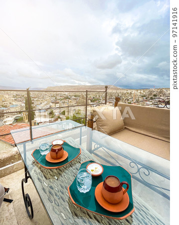 Cup with traditional Turkish coffee on a background of a valley in Cappadocia, Turkey. Cup with traditional Turkish coffee on a background of a valley in Cappadocia, Turkey. 97141916