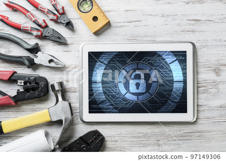 Web security and technology concept with tablet pc on wooden table 97149306
