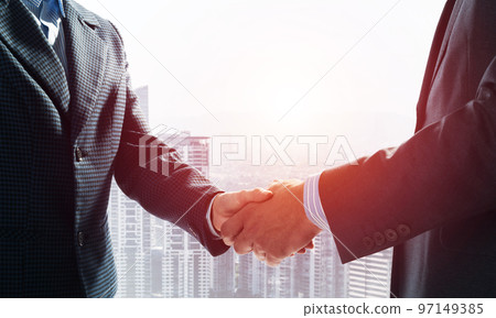 Close-up of the handshake of businessmen. Close-up of the handshake of businessmen. 97149385