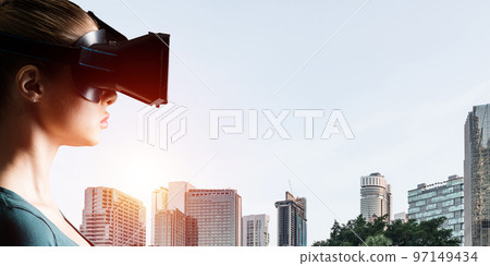 Young woman in VR goggles Young woman in VR goggles 97149434