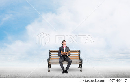 Young student with a book 97149447