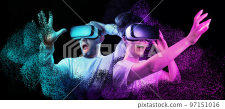 Metaverse web banner. Shocked disappearing bald, bearded man and happy woman VR glasses. Black background with neon grid. Concept of 3D simulation, virtual reality and cyberspace. 97151016